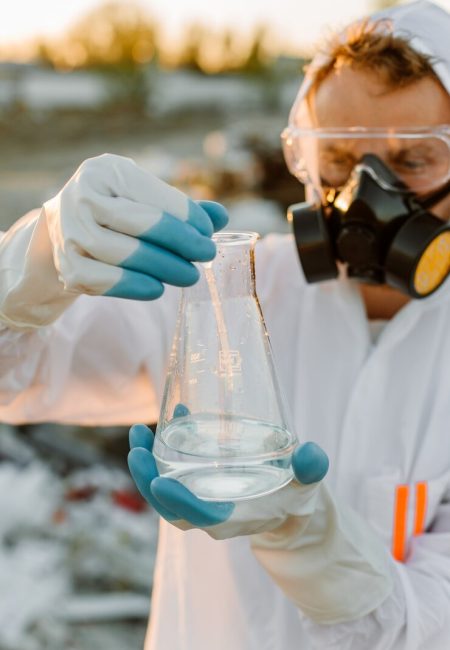male-ecologist-radiation-suit-gas-mask-holding-test-tube-with-liquid-while-studying-trash-dump_1157-48407 male-ecologist-radiation-suit-gas-mask-holding-test-tube-with-liquid-while-studying-trash-dump_1157-48407